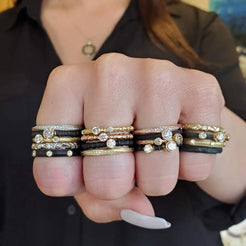 A handful of rings on every finger designed by Sarah Graham
