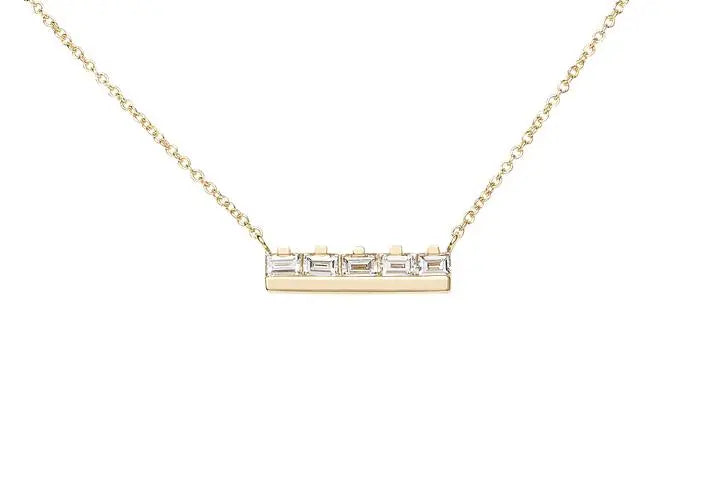 The At the Bar 5 baguette necklace is a classic piece, for a classic lady.  5 gorgeous baguettes sitting up at a solid 18k recycled gold bar.  5 ethically sourced baguette diamonds Total carat weight: 0.7 18K recycled yellow gold Measurements: 4.4mm/.17 inches high, 22.3mm/.88 inches wide Designed by Alex Fitz