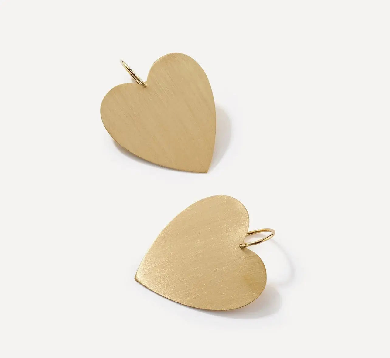 This piece is from the classic collection and is Irene's signature large flat heart-shaped drop earrings in 18k yellow gold with a satin finish.  Designed by Irene Neuwirth and made in LA