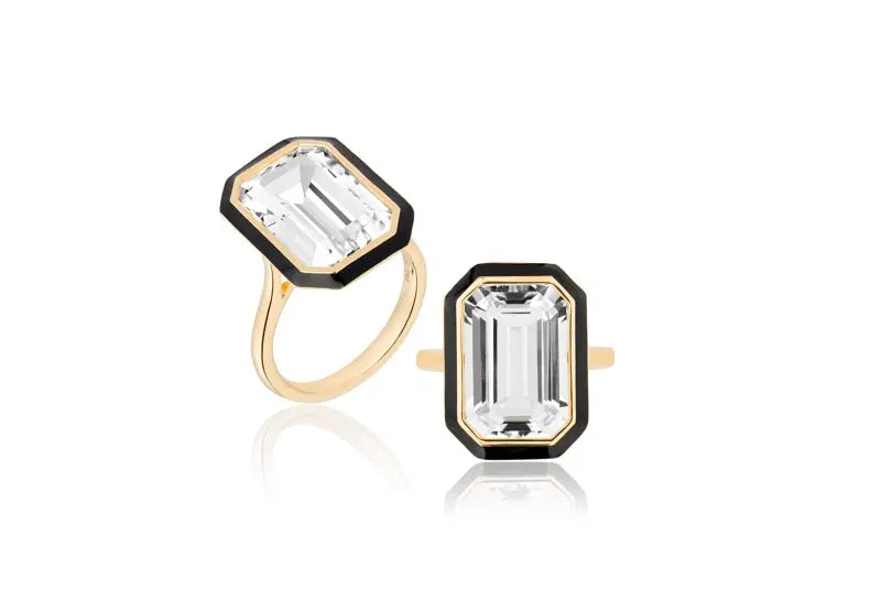 'Queen' Rock Crystal Emerald Cut Ring With Black Enamel. The stone measures -10x15 and ~ 7.00 cttw. The ring is set in 18k yellow gold. The ring size is 6.5. If you need a different size, plese email shop@sbvail.com.